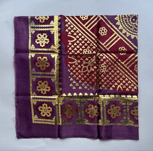 Purple fabric with gold intricate.patterns 